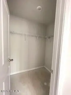 806 Palm Frond Way NW, Calabash, NC 28467 – photo 17: bedroom up walk in closet