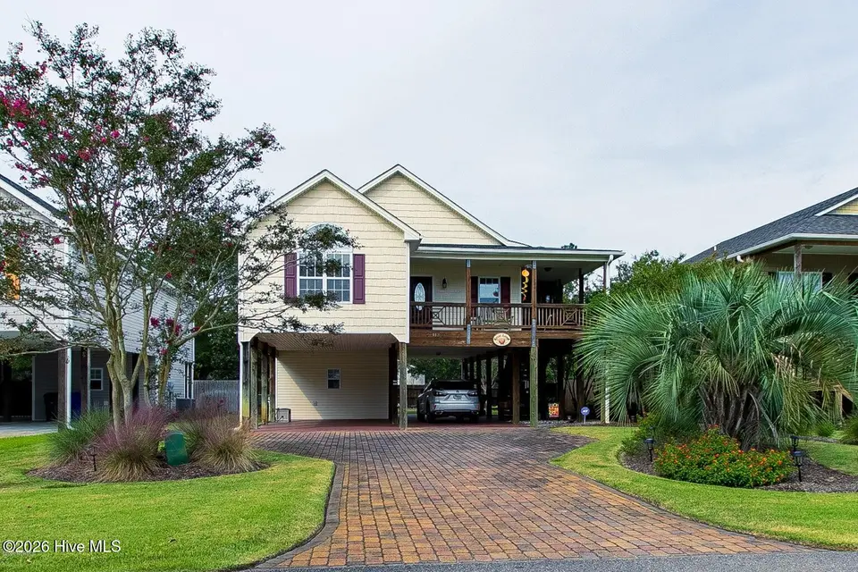 113 NW 9th Street, Oak Island, NC 28465 – photo 1 of 23: Front