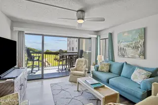 8801 Reed Drive 115, Emerald Isle, NC 28594 – photo 4: Living Room w/ Water Views