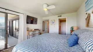 8801 Reed Drive 115, Emerald Isle, NC 28594 – photo 14: Primary Bedroom w/ Balcony Access