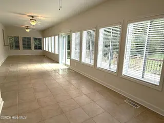 103 Castelnau Court, Jacksonville, NC 28540 — 5-bedroom home in Williamsburg Plantation, Jacksonville, NC, photo 16 of 52: 8. Sunroom C