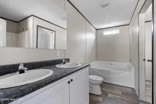 490 Orchard Lane SE, Bolivia, NC 28422 — 3-bedroom manufactured home in Vineyard Plantation, Bolivia, NC, photo 21 of 27: Master bath