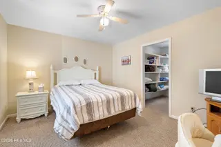 166 NW 7th Street, Oak Island, NC 28465 – photo 23: Upstairs 1st bedroom