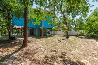 119 NE 27th Street, Oak Island, NC 28465 – photo 22: bloomed backyard