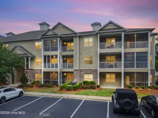 221 Woodlands Way Unit 21, Calabash, NC 28467 — 2-bedroom condo in Crow Creek, Calabash, NC, photo 4 of 39: Parking View in Evening