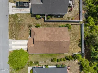 5014 N Hampton Drive SE, Southport, NC 28461 – photo 4: 4-web-or-mls-DJI_20260415124124_0396_D