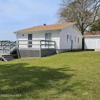 1229 Fletcher Hewett Road SW, Shallotte, NC 28470 — 2-bedroom home, Shallotte, NC, photo 2 of 52: Front/Side