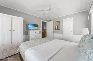 392 E First Street, Ocean Isle Beach, NC 28469 – photo 17: left side primary bedroom