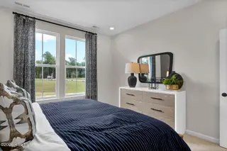 1218 Sunwater Terrace, Leland, NC 28451 — 4-bedroom townhome in Grand Park, Leland, NC, photo 17 of 49: Second Primary Bedroom 2 - Hyacinth BE -