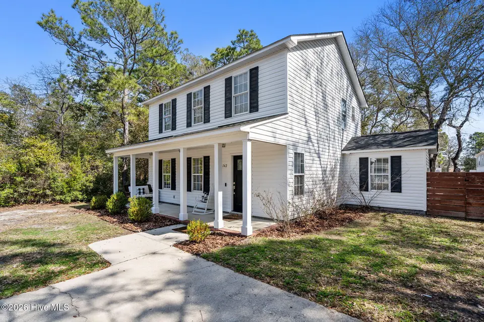 142 NE 14th Street, Oak Island, NC 28465 — 3-bedroom home in Tranquil Harbor, Oak Island, NC, photo 1 of 60: 56-web-or-mls-DSC06066