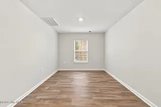 212 Gracie Farms Road, New Bern, NC 28560 — 4-bedroom home in Tyler, Home on the Lake, New Bern, NC, photo 13 of 32: Dining Room Empty