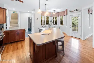 2790 Creek Bridge Court, Southport, NC 28461 — 3-bedroom home in St James, Southport, NC, photo 15 of 72: Kitchen Dining faces gorgeous backyard
