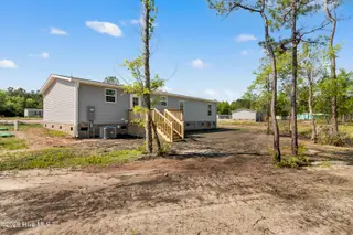 6830 Lewis Drive SE, Winnabow, NC 28479 – photo 5: Back yard