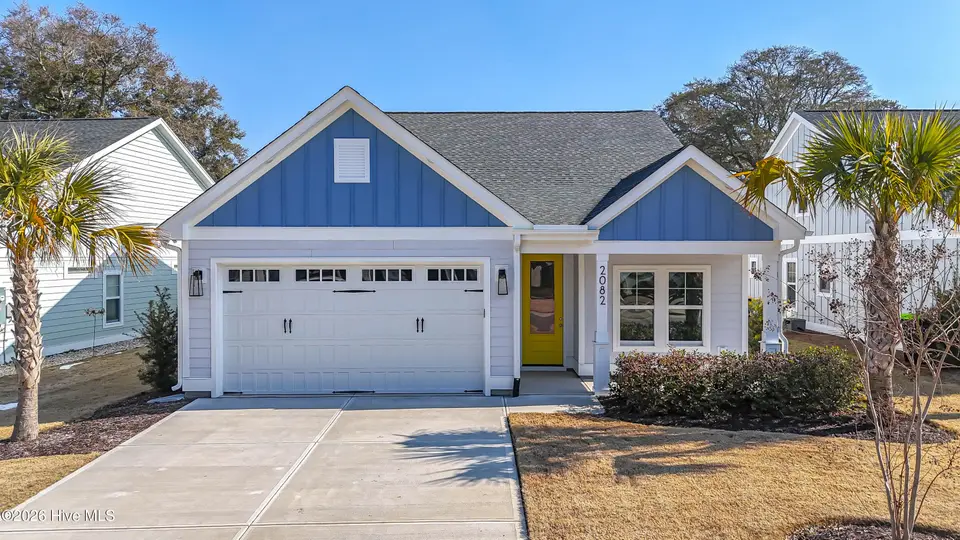 2082 Greenside Manor Drive SW, Ocean Isle Beach, NC 28469 – photo 1 of 54: DJI_20260206110644_0026_D