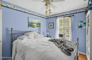 121 NE 6th Street, Oak Island, NC 28465 – photo 12: 26_121_NE_6th_St-Bedroom-GE61