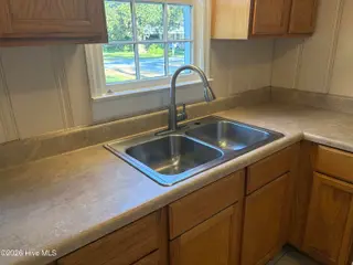 303 Dallas Avenue, Lake Waccamaw, NC 28450 — 3-bedroom home, Lake Waccamaw, NC, photo 8 of 40: Kitchen Sink