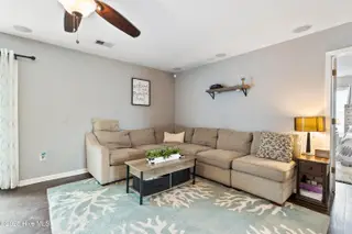 2947 Bay Village Street, Shallotte, NC 28470 — 3-bedroom home in Green Bay Village, Shallotte, NC, photo 10 of 33: Cozy main living with a fireplace
