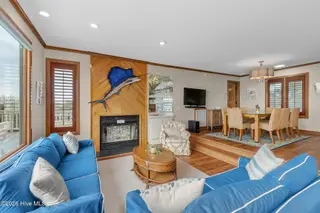 111 Dogwood Circle, Pine Knoll Shores, NC 28512 – photo 5: Living room with fireplace