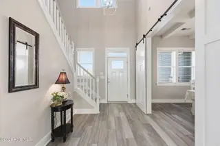 209 Bogue Carrier Court, Newport, NC 28570 – photo 4: Barn doors to the Dining Room
