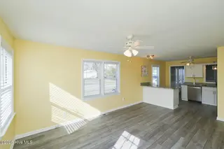 802 E Oak Island Drive, Oak Island, NC 28465 – photo 14: Living Room Kitchen-011-014-1500x1000