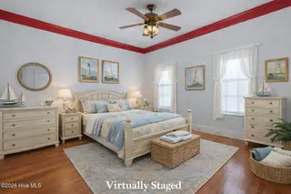 301 E Moore Street, Southport, NC 28461 – photo 22: Nautical-inspired bedroom with elegant d