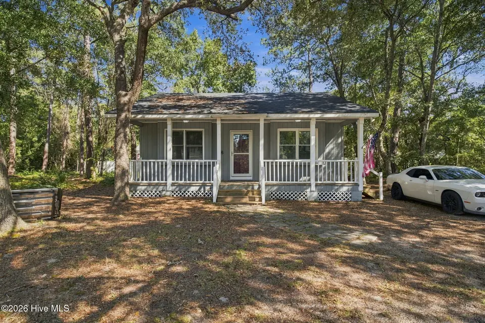 114 NW 23rd Street, Oak Island, NC 28465 — 2-bedroom home in Pinners Point, Oak Island, NC, photo 1 of 32: 30-web-or-mls-DSC09417