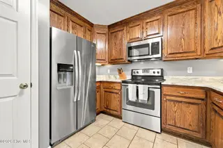 107 Fodder Drive, Hubert, NC 28539 — 3-bedroom home in Ole Mill Village, Hubert, NC, photo 18 of 59: 18_Kitchen_Fridge