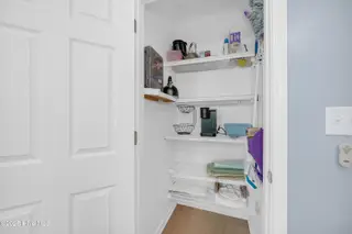 409 Womble Street, Oak Island, NC 28465 – photo 19: Nicely Sized Kitchen Pantry