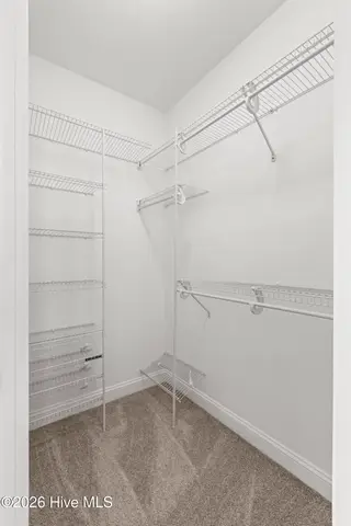 112 Oakleaf Drive 1003-A, Pine Knoll Shores, NC 28512 – photo 16: Master Bedroom - walk in closet