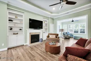 5117 Stoney Point Drive, Leland, NC 28451 – photo 11: Living room with fireplace and built ins