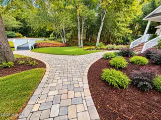 301 Wisteria Way, Caswell Beach, NC 28465 – photo 5: Front Walkway