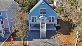 129 N Middleton Avenue, Oak Island, NC 28465 – photo 4: 70-Final 129 N Middleton Ave-RJREM--3
