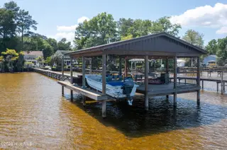 2313 Waccamaw Shores Road, Lake Waccamaw, NC 28450 – photo 13: Spacious Pier - with boat lift