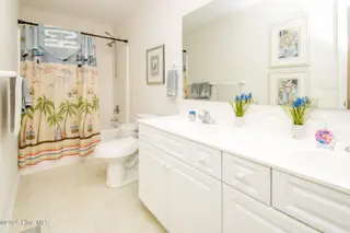 1131 S Shore Drive, Surf City, NC 28445 – photo 20: Streetside North King Bedroom En Suite