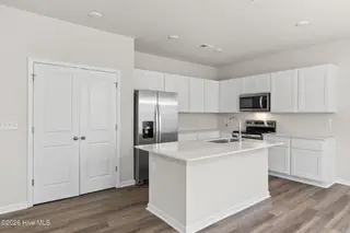 1063 Hanson Drive, Leland, NC 28451 – photo 8: Kitchen with Lots of Cabinets