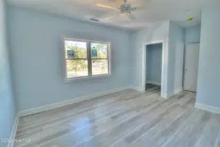 6926 Beach Drive SW, Ocean Isle Beach, NC 28469 — 3-bedroom home in Pine Acres, Ocean Isle Beach, NC, photo 7 of 12: Master bedroom
