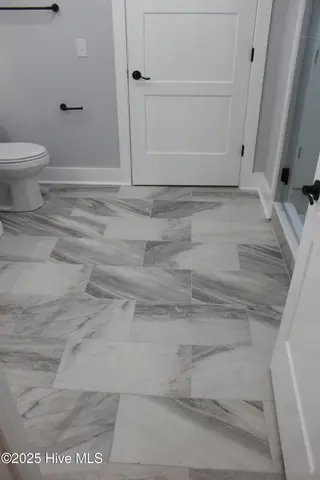 316 Bobbys Drive, Newport, NC 28570 – photo 22: Master bath tiled floor