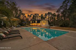 10020 S Olde Towne Wynd, Belville, NC 28451 — 3-bedroom home in Olde Towne, Belville, NC, photo 5 of 56: 10020SOldeTowneWyndSE-16_Dusk