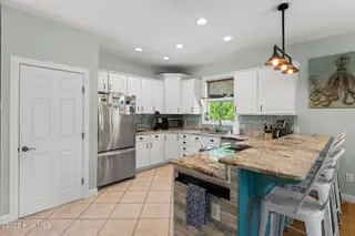 9804 Heath Place, Emerald Isle, NC 28594 – photo 8: Kitchen (A) 2nd floor