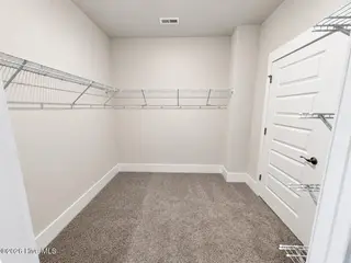 8615 Blue Haw Way Lot 125, Leland, NC 28451 — 3-bedroom home in Indigo Preserve, Leland, NC, photo 19 of 41: Primary Closet