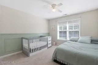 404 Hidden Oaks Drive, Jacksonville, NC 28546 – photo 20: Serene nursery and bedroom blend