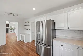 1281 Spring Lake Drive, Southport, NC 28461 — 3-bedroom home, Southport, NC, photo 13 of 46: Kitchen with Built-In Desk