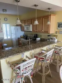 801 Salter Path Road 108, Indian Beach, NC 28512 – photo 6: Kitchen/bar stool