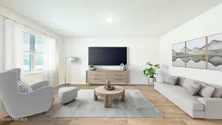 3200 Butterfly Ginger Street Lot 149, Leland, NC 28451 — 4-bedroom home in Indigo Preserve, Leland, NC, photo 6 of 39: Bradford_Living_Room_Staged_1