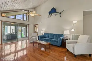 930 Tidewater Lane, Carolina Beach, NC 28428 – photo 9: Living Room to Sunroom