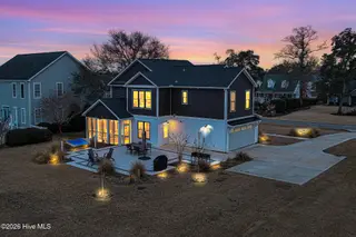542 Deer Creek Drive, Cape Carteret, NC 28584 – photo 8: Rear Exterior at dusk