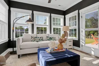 1308 Pandion Drive, Wilmington, NC 28411 – photo 9: Sunroom 2 - Nantanaha - Cottages at Brad