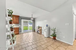 107 Fodder Drive, Hubert, NC 28539 — 3-bedroom home in Ole Mill Village, Hubert, NC, photo 22 of 59: 22_Dining_Toward_Patio