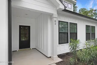 82 Northeast Drive NW, Calabash, NC 28467 – photo 2: 82NE Front entry & siding