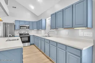 127 NW 19th Street, Oak Island, NC 28465 – photo 13: Plenty of kitchen storage